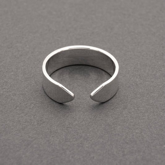 A front view of a minimalist design wide band ring in silver.