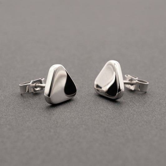 Two minimalist design silver earrings in a soft triangular shape.