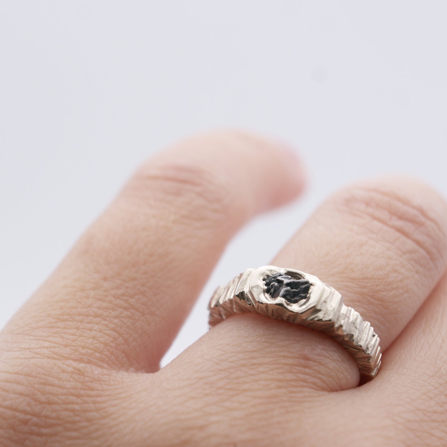 ENGAGEMENT RING WITH METEORITE AND BLACK SAPPHIRE
