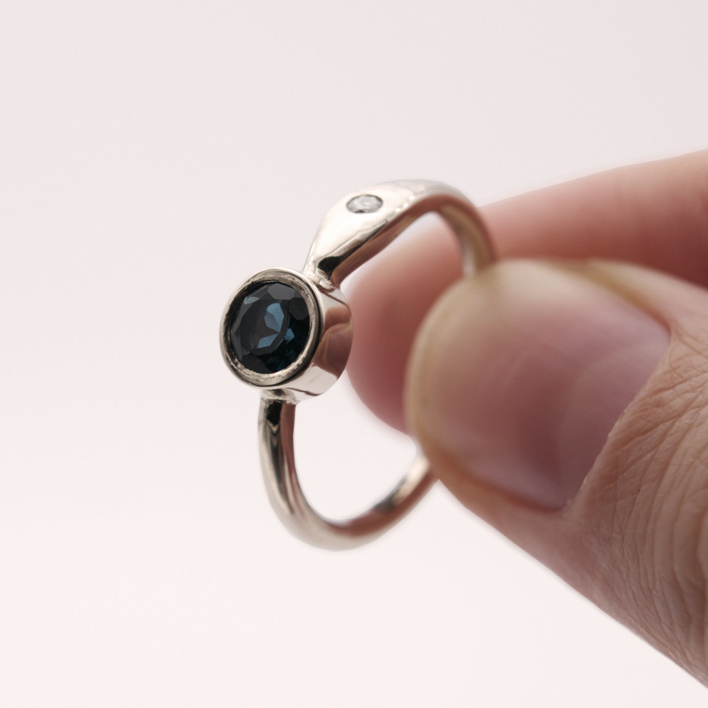 ENGAGEMENT RING WITH LONDON BLUE TOPAZ AND DIAMONDS