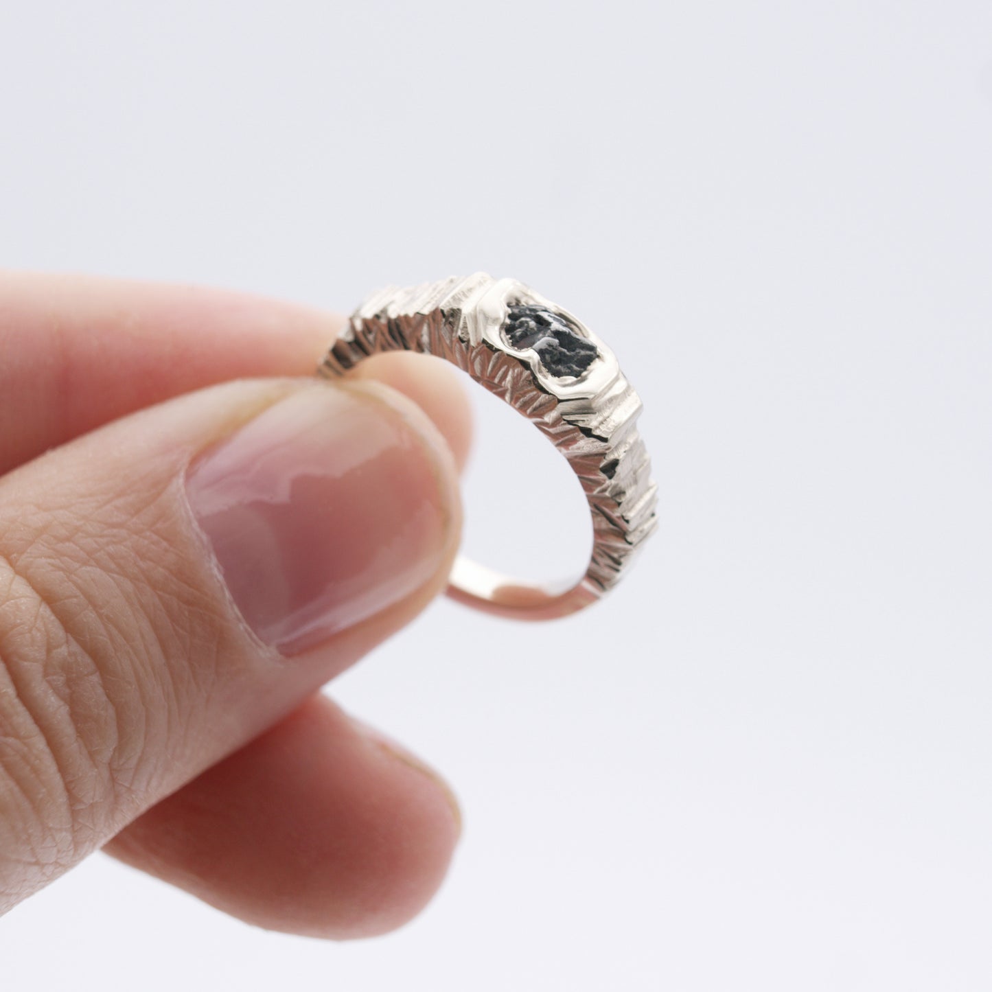 ENGAGEMENT RING WITH METEORITE AND BLACK SAPPHIRE