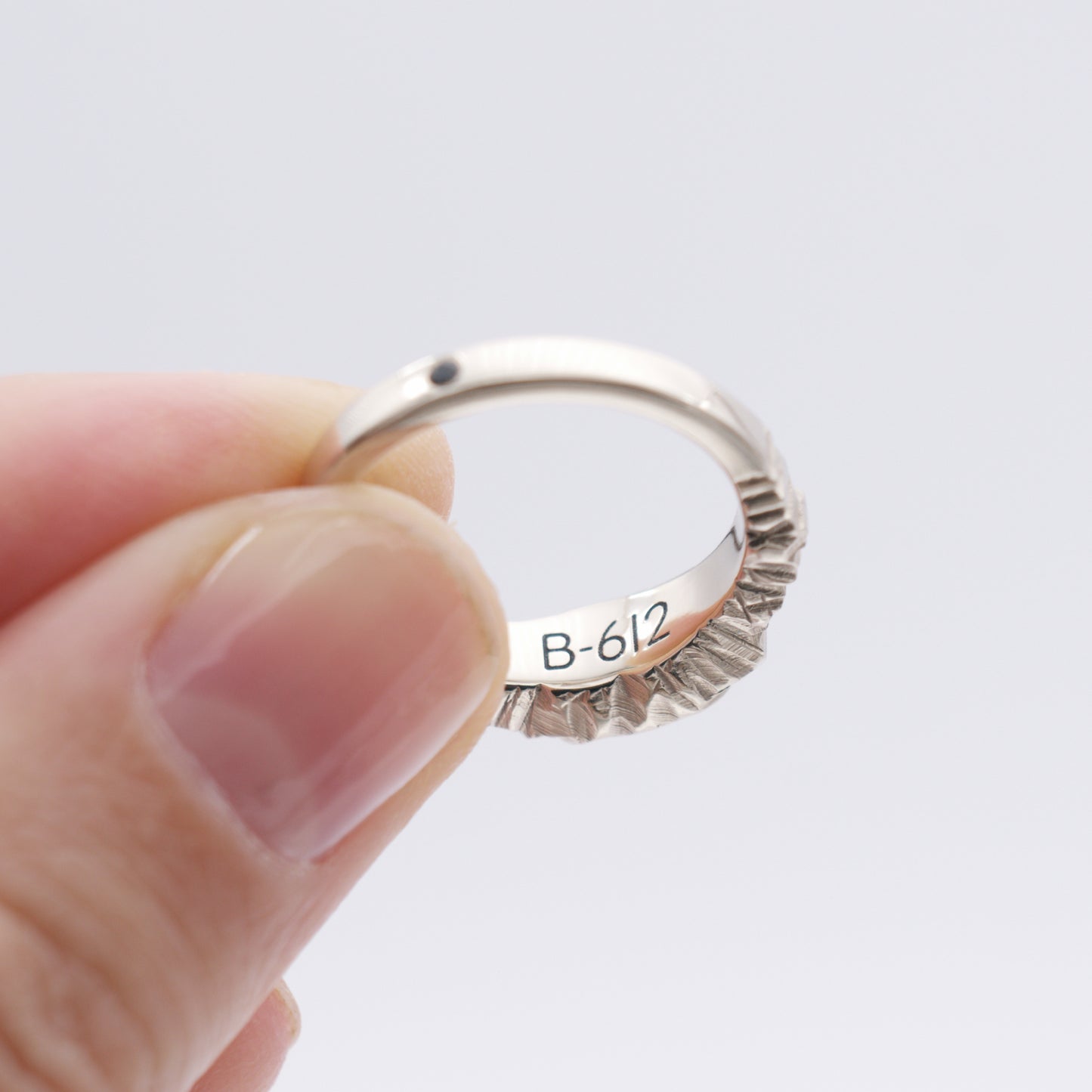 ENGAGEMENT RING WITH METEORITE AND BLACK SAPPHIRE